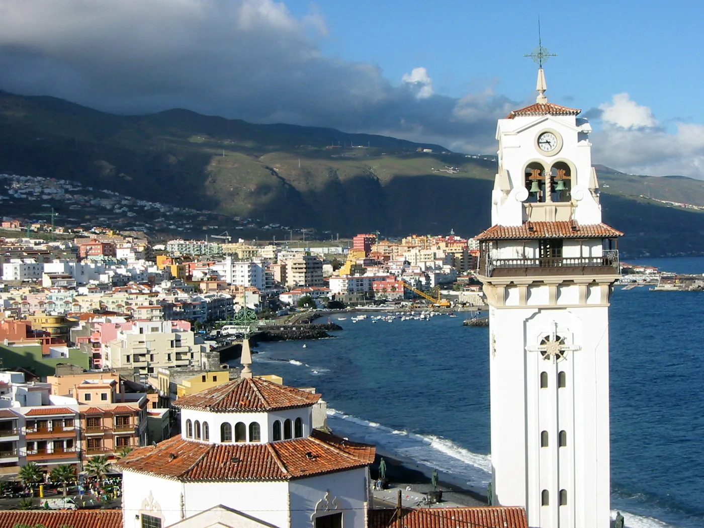 The bell tower of the Basilica of Candelaria above the town and the sea, Tenerife.