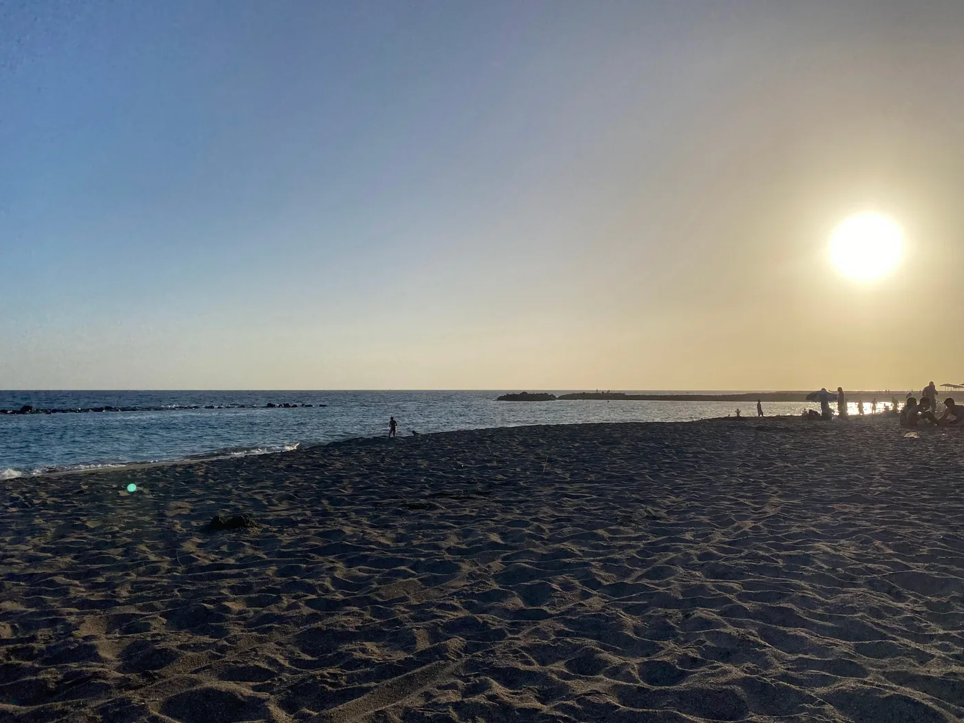 Playa del Duque in Costa Adeje, Tenerife: pale sand, sunshades and the hotels behind.