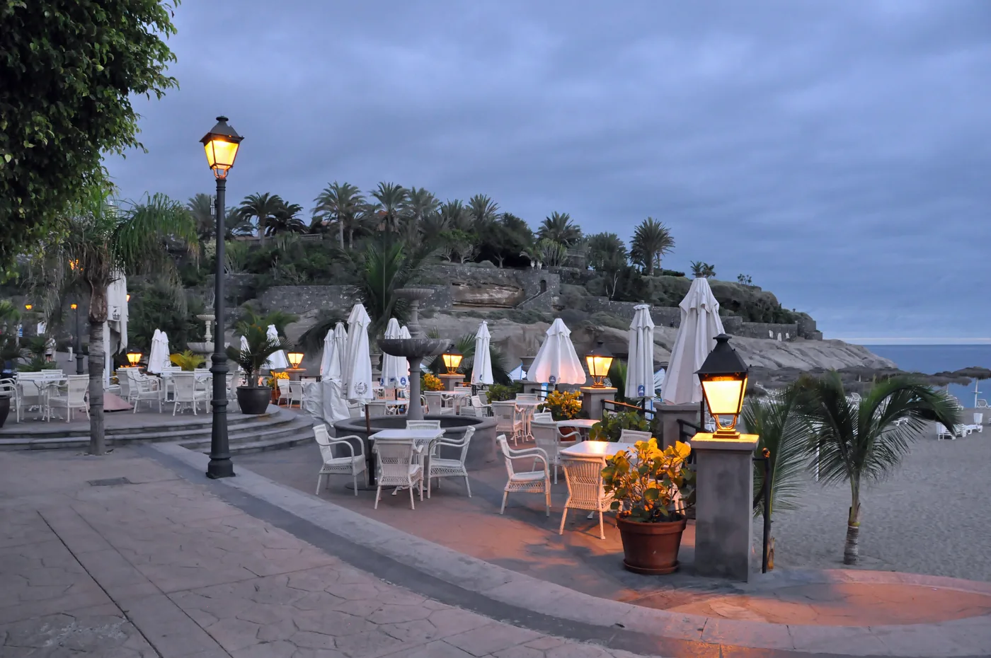 Playa del Duque seafront at dusk in Costa Adeje, Tenerife.