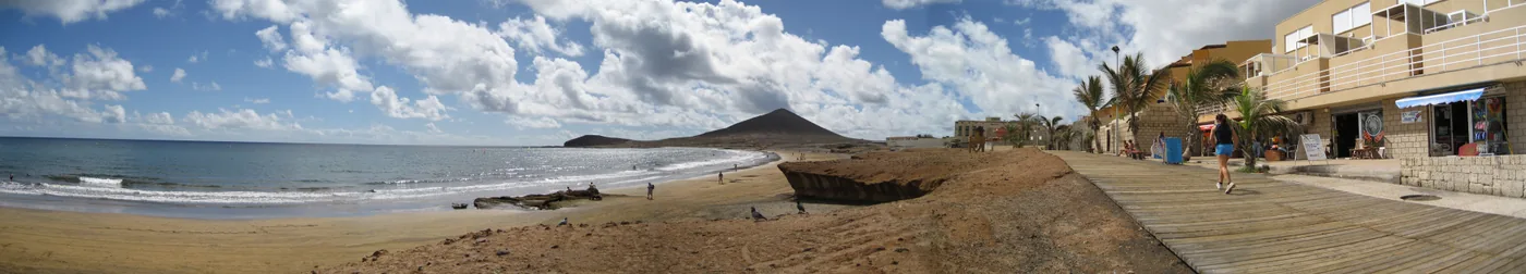 El Médano’s beach and promenade with the Montaña Roja volcano at the end, Tenerife.