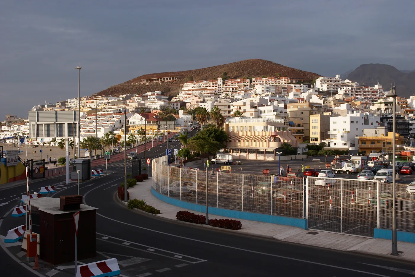 The port road at Los Cristianos, Tenerife, with the white town rising up the hill behind.