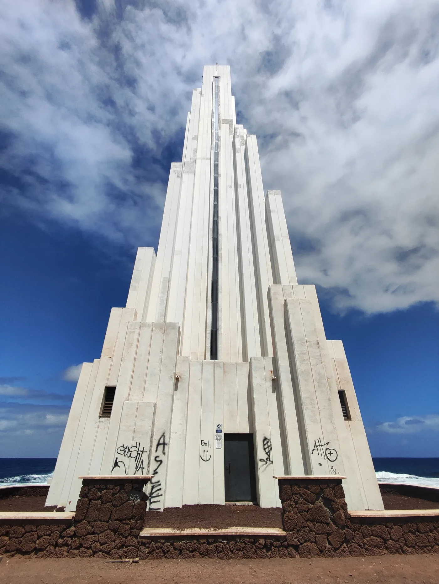 The modern white lighthouse of Punta del Hidalgo on the rocky north-east coast of Tenerife.