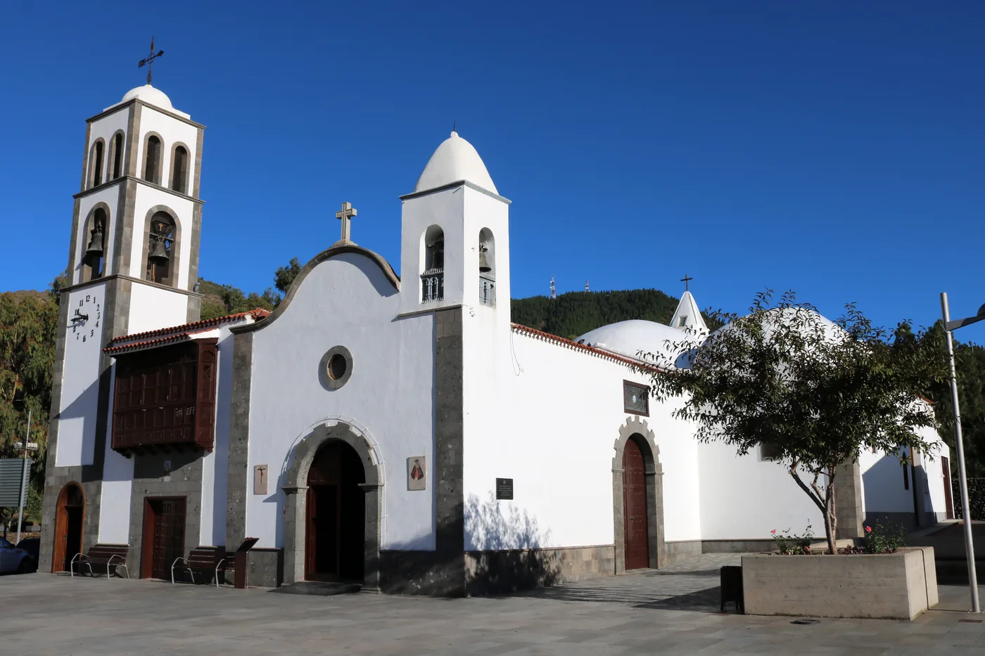 The white church of Santiago del Teide with its domes against a blue sky, Tenerife.